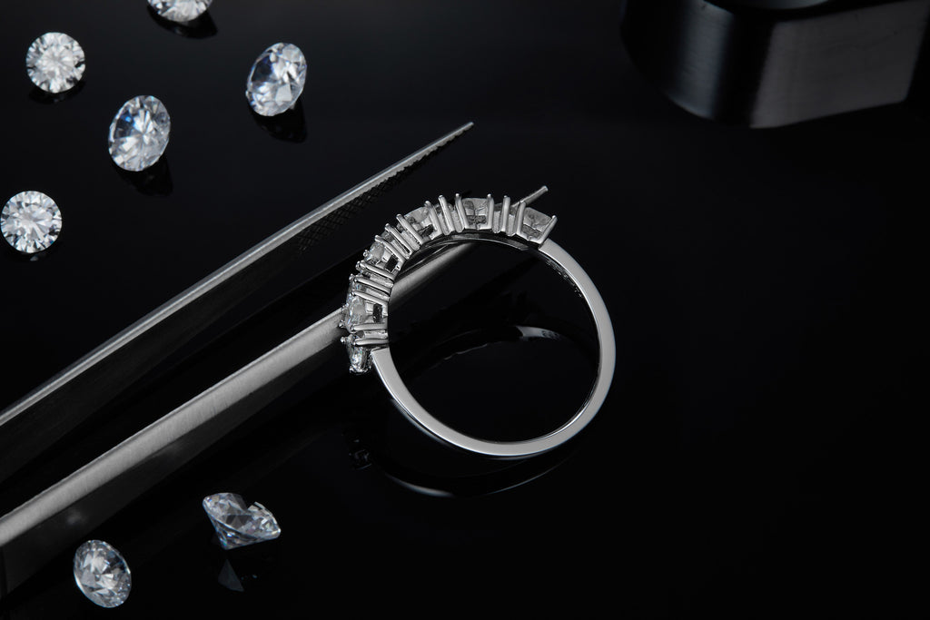 Millecuori Heart-Cut Moissanite Half Eternity Ring in Sterling Silver, styled product photo