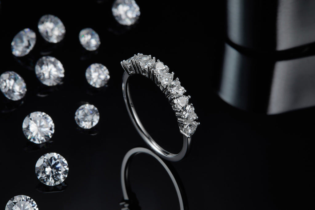 Millecuori Heart-Cut Moissanite Half Eternity Ring in Sterling Silver, styled product photo