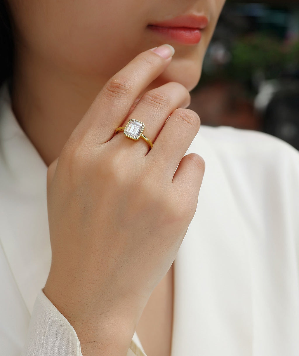 Mirador 3 Carat Emerald-Cut Moissanite Bezel Ring in Gold-Tone Sterling Silver, shown worn