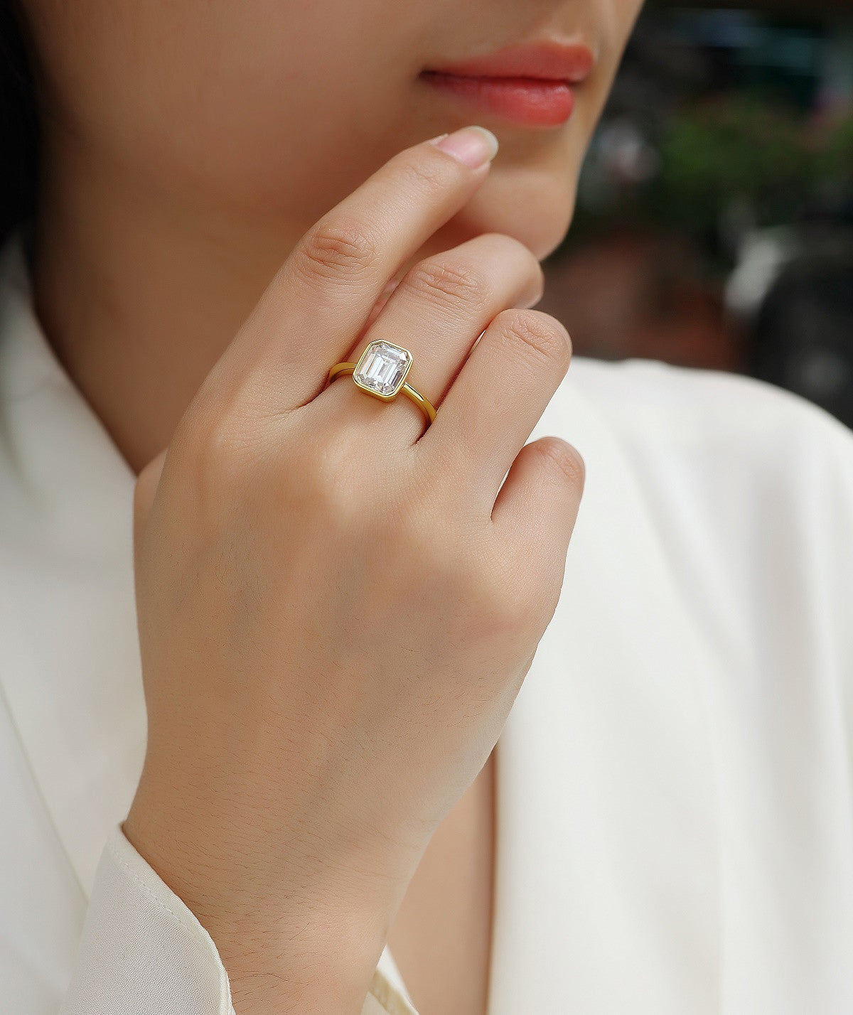 Mirador 3 Carat Emerald-Cut Moissanite Bezel Ring in Gold-Tone Sterling Silver, shown worn
