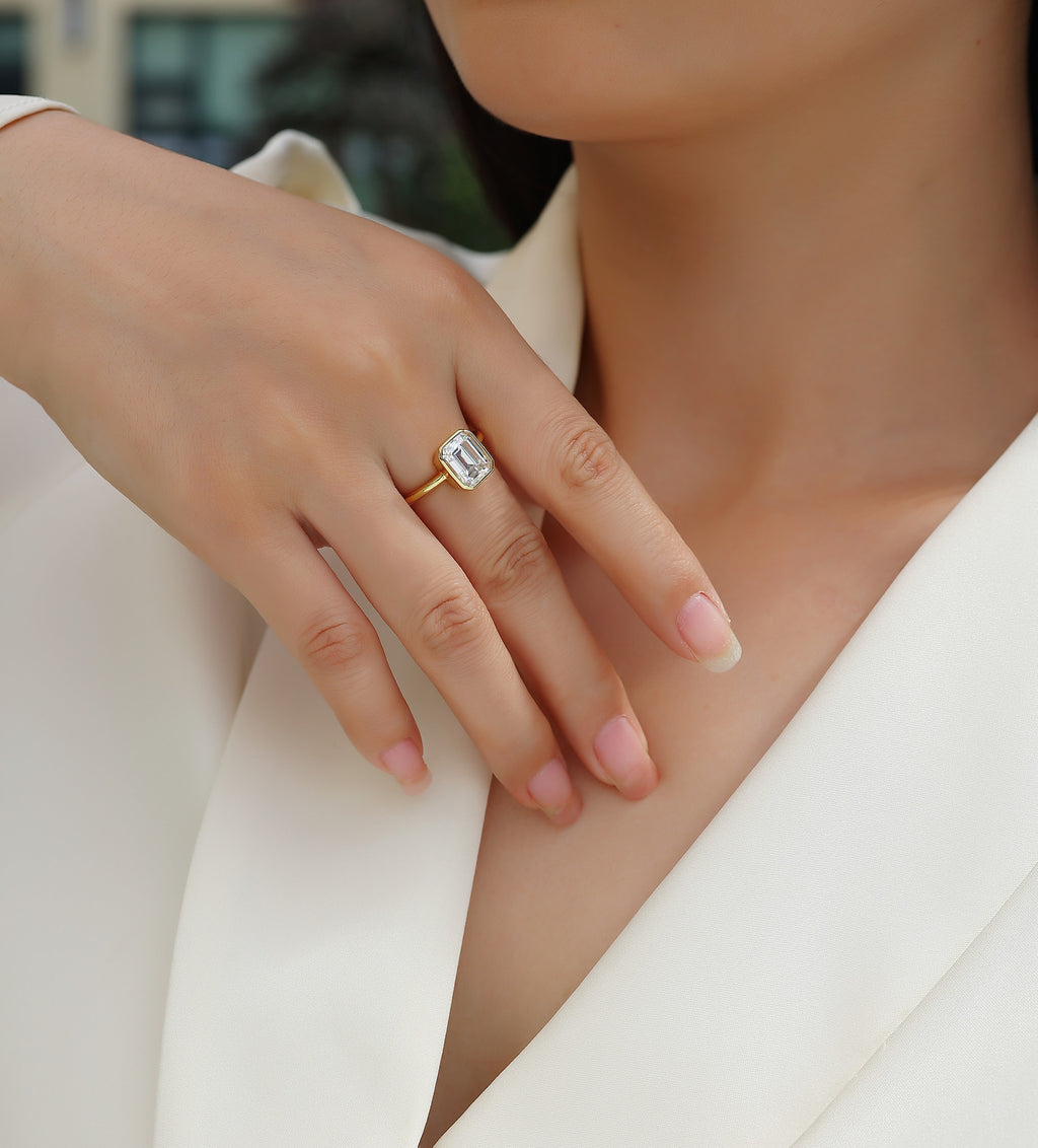 Mirador 3 Carat Emerald-Cut Moissanite Bezel Ring in Gold-Tone Sterling Silver, shown worn