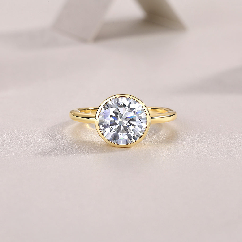 Ora 3 Carat Moissanite Bezel Solitaire Ring in Gold-Tone Sterling Silver, styled product photo
