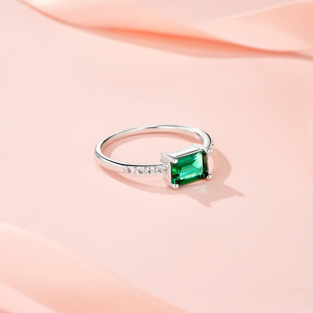 Menta Emerald-Cut Lab-Grown Emerald Solitaire Ring in Sterling Silver, styled product photo