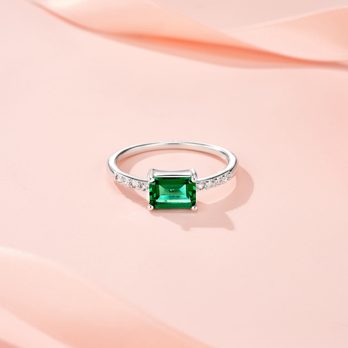 Menta Emerald-Cut Lab-Grown Emerald Solitaire Ring in Sterling Silver, styled product photo