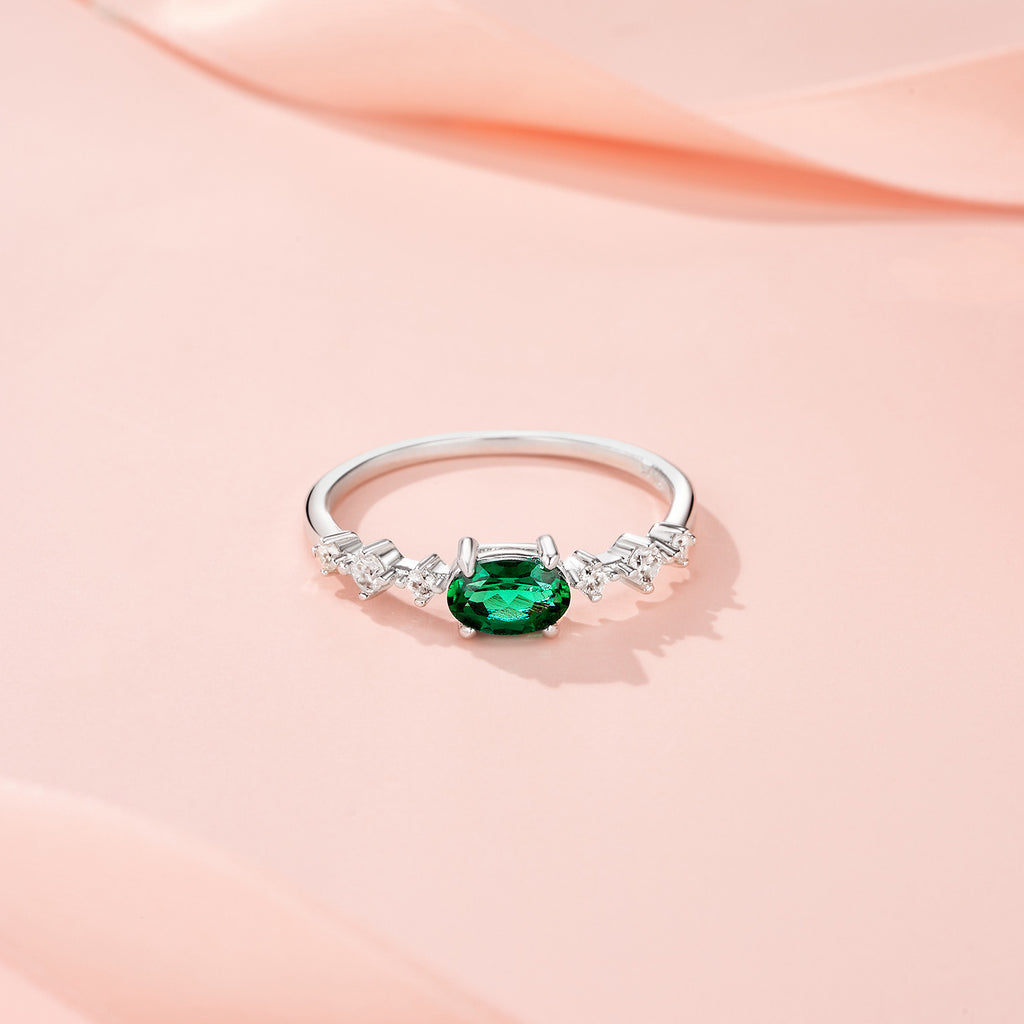 Orsa Oval-Cut Lab-Grown Emerald Solitaire Ring in Sterling Silver, styled product photo