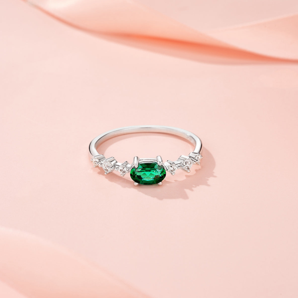 Orsa Oval-Cut Lab-Grown Emerald Solitaire Ring in Sterling Silver, styled product photo