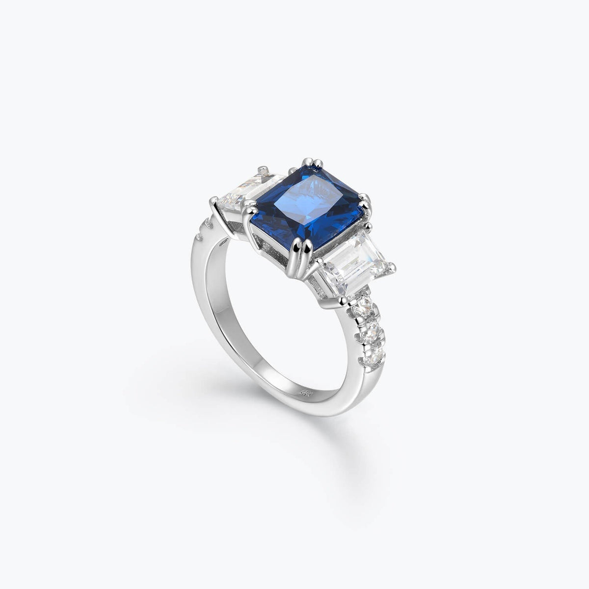 Azzurra blue cubic zirconia three-stone ring, angled view