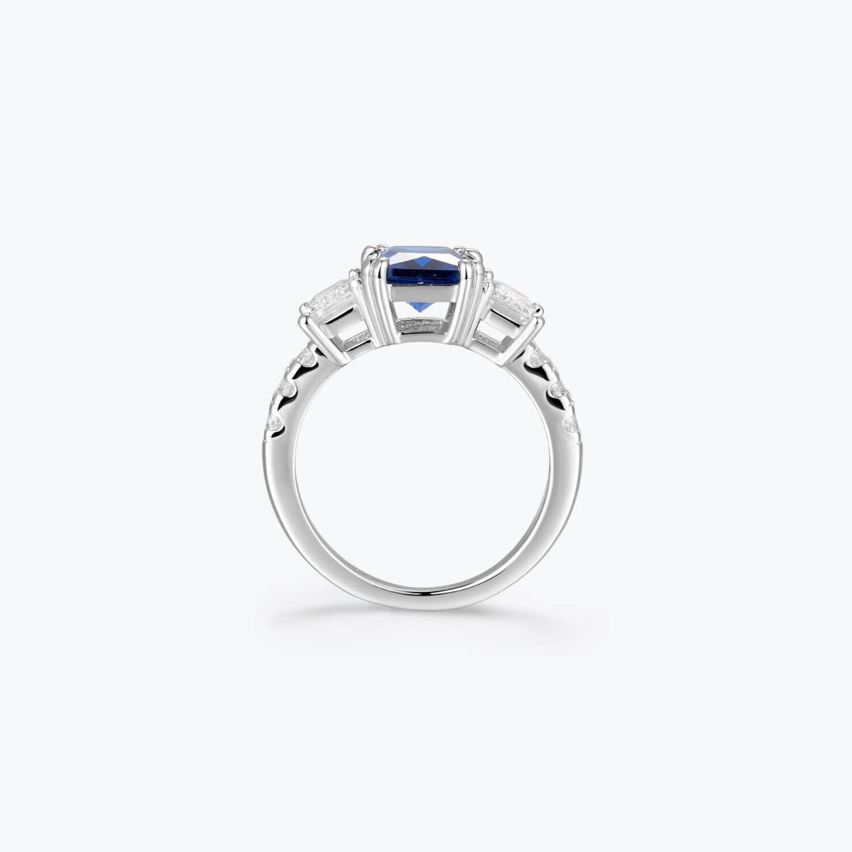Azzurra blue cubic zirconia three-stone ring, profile view