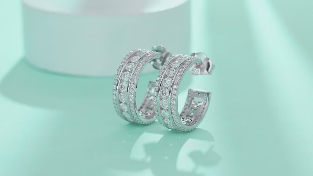 Treble Moissanite Huggie Hoop Earrings in Sterling Silver — video
