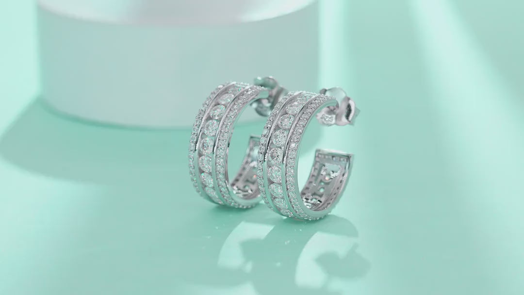 Treble Moissanite Huggie Hoop Earrings in Sterling Silver — video