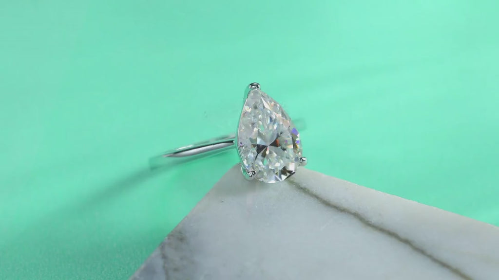 Minima Pear-Cut Moissanite Solitaire Ring in Sterling Silver — video