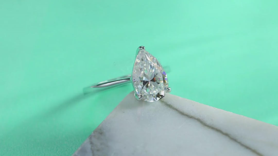Minima Pear-Cut Moissanite Solitaire Ring in Sterling Silver — video
