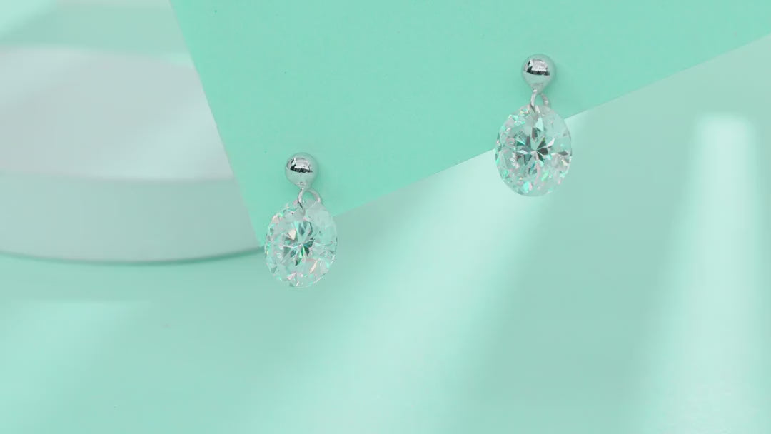 Orb Moissanite Stud Earrings in Sterling Silver — video
