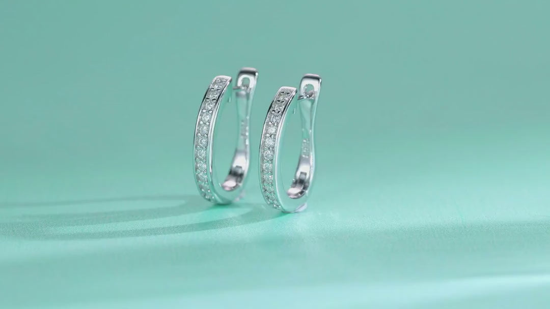 Sleek Moissanite Huggie Hoop Earrings in Sterling Silver — video